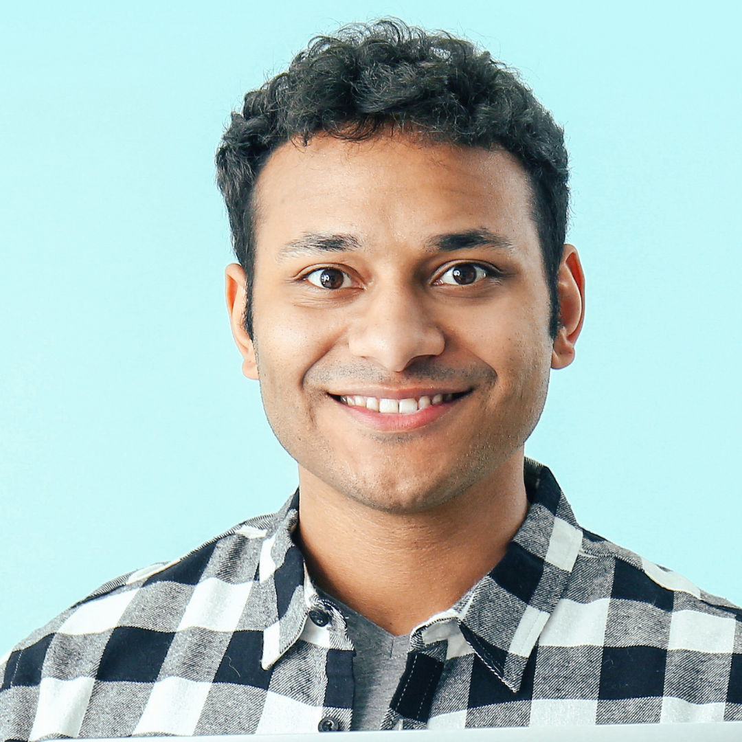 A cute black girl smiling with curly hair in a purple background
