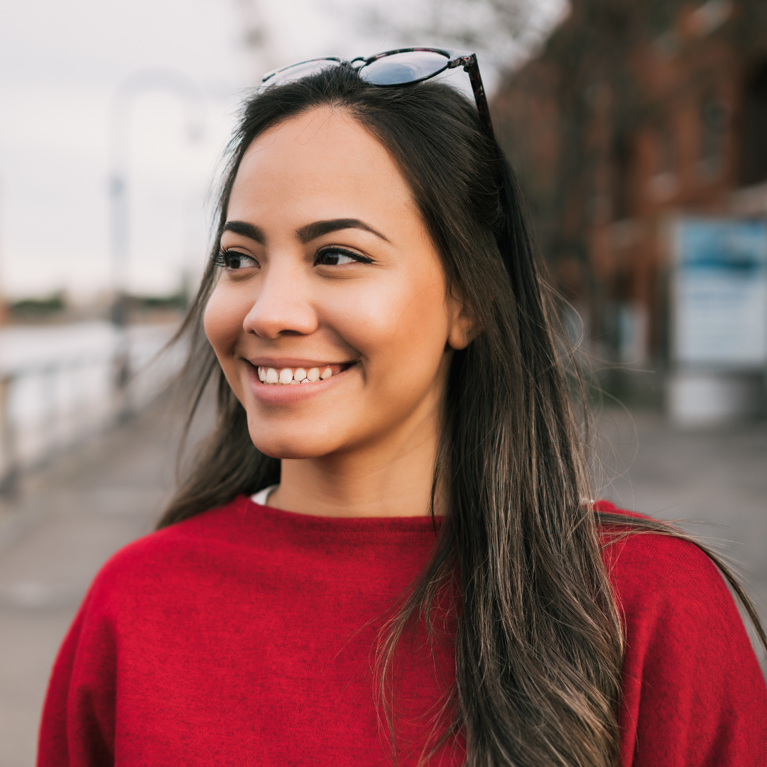 An old man with white beard smiling in a bege background